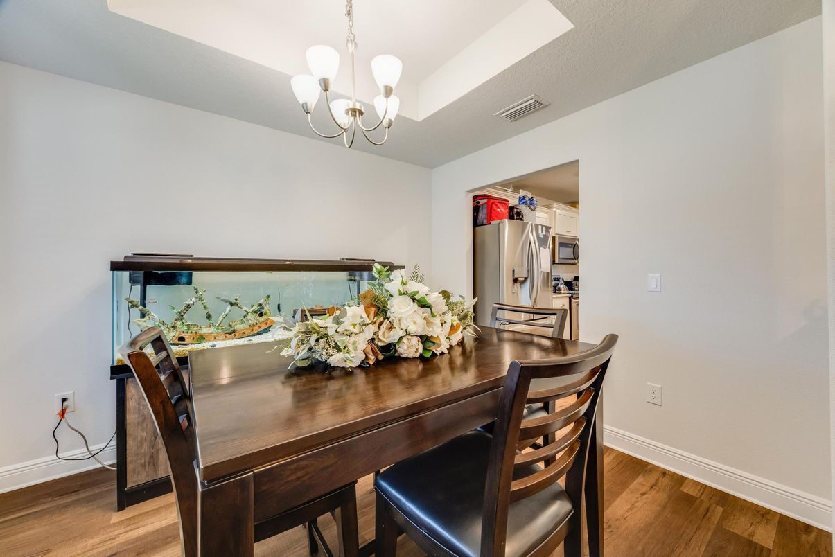 Chandelier, Dining room, Interior, Stainless Steel Appliances, Wood Texture Flooring
