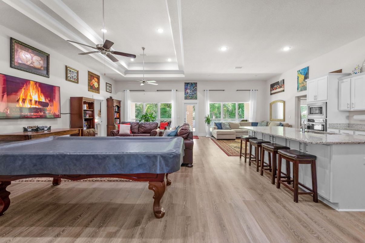 Billiard Table, Fireplace, Game Room, Interior, Living room, Recessed Lighting, Wood Texture Flooring