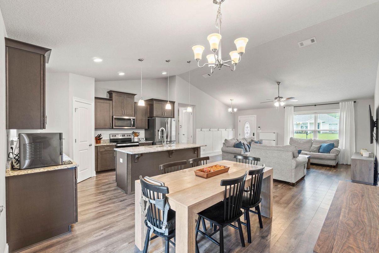 Chandelier, Dining room, Interior, Kitchen, Living room, Pendant Lights, Recessed Lighting, Stainless Steel Appliances, Wood Texture Flooring