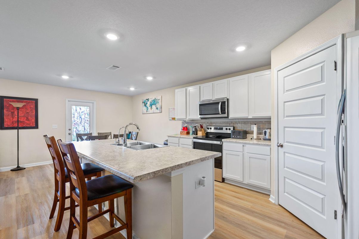 Dining room, Interior, Kitchen, Recessed Lighting, Stainless Steel Appliances, Wood Texture Flooring