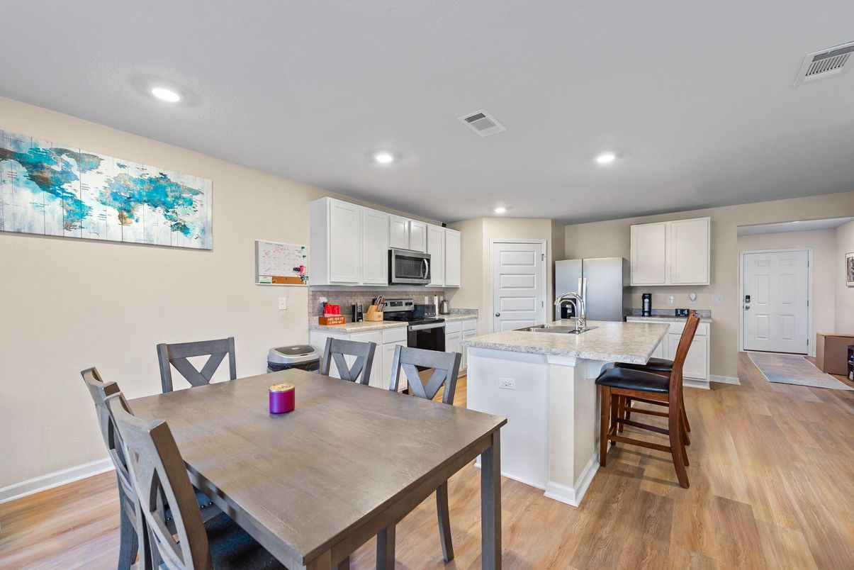 Dining room, Interior, Kitchen, Recessed Lighting, Stainless Steel Appliances, Wood Texture Flooring