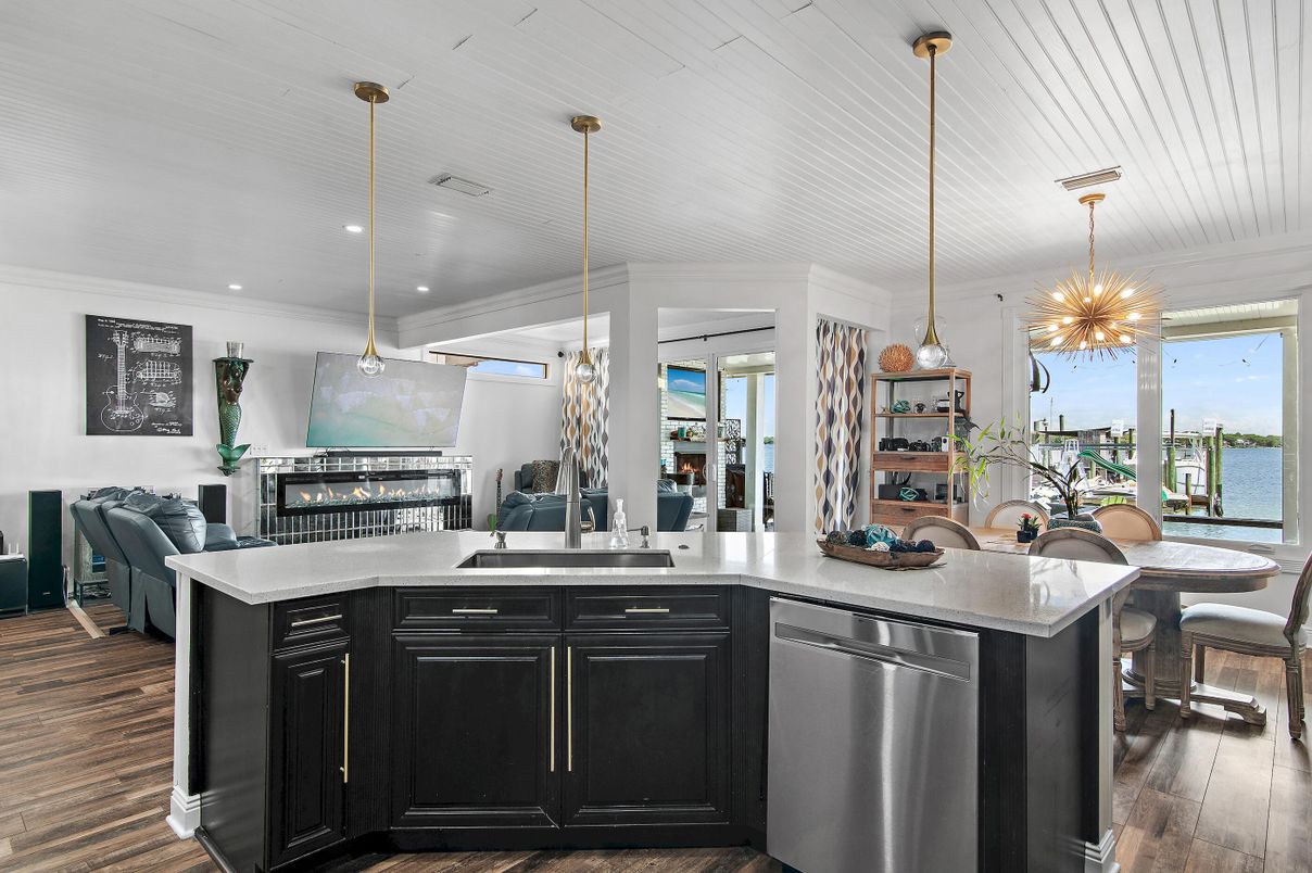 Dining room, Fireplace, Interior, Kitchen, Pendant Lights, Recessed Lighting, Water, Wood Texture Flooring