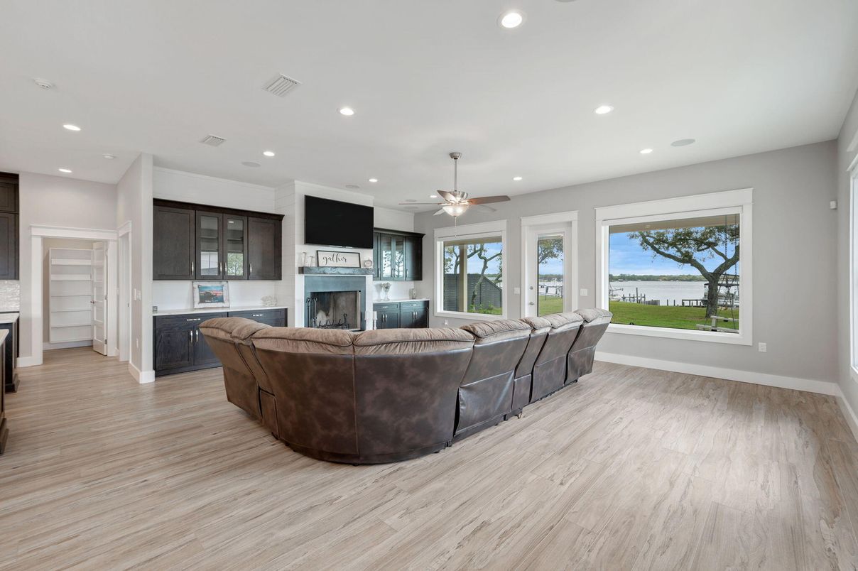 Fireplace, Interior, Living room, Recessed Lighting, Water, Wood Texture Flooring