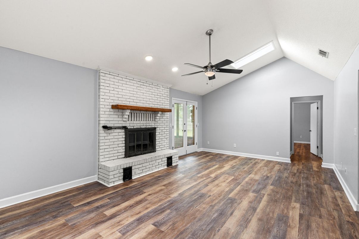 Empty room, Fireplace, Interior, Recessed Lighting, Stone Walls, Wood Texture Flooring