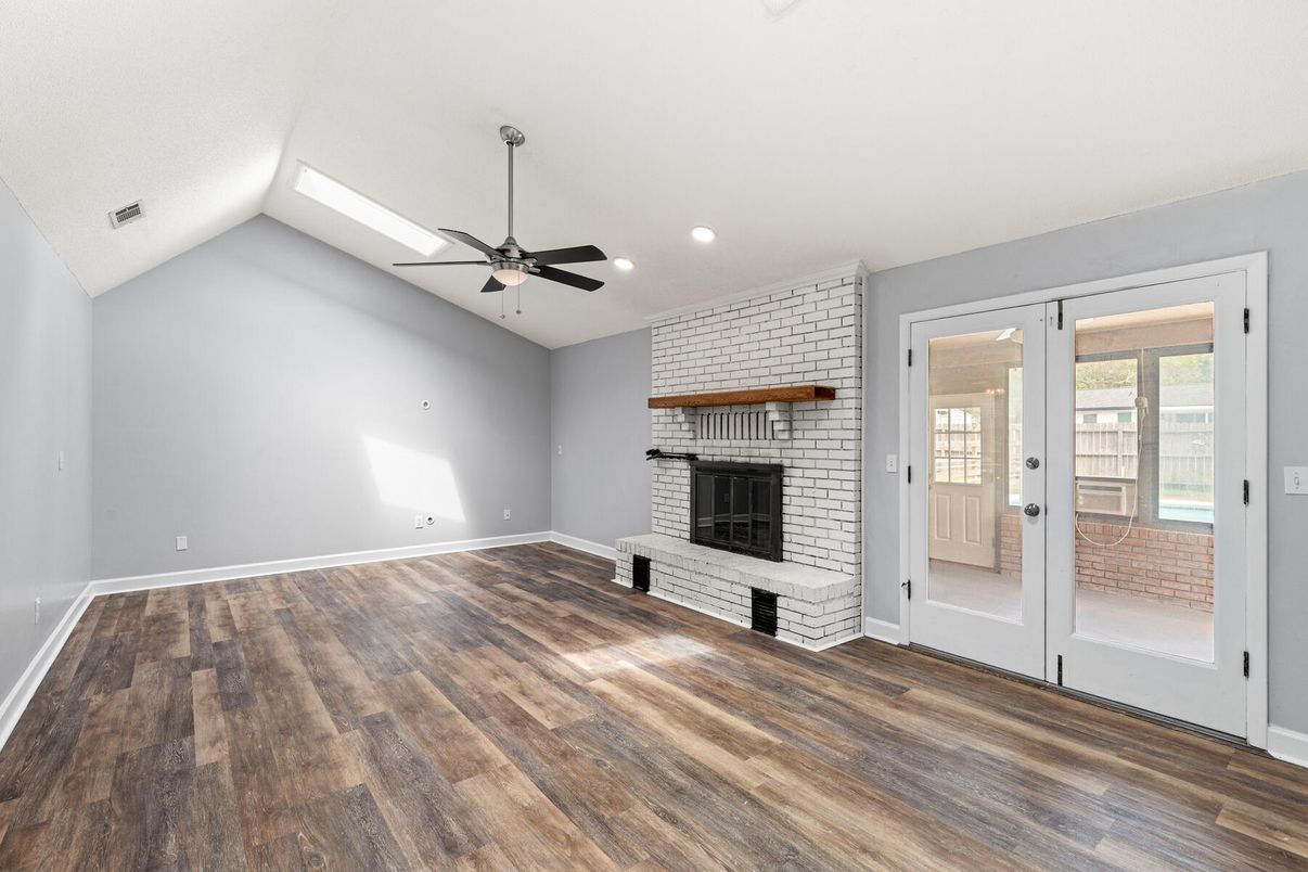 Empty room, Fireplace, Interior, Recessed Lighting, Stone Walls, Wood Texture Flooring