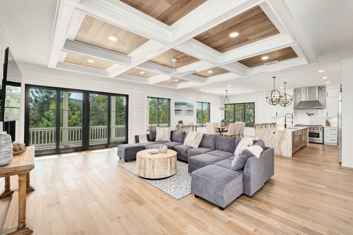 Chandelier, Dining room, Interior, Kitchen, Living room, Pendant Lights, Recessed Lighting, Stainless Steel Appliances, Wood Texture Flooring