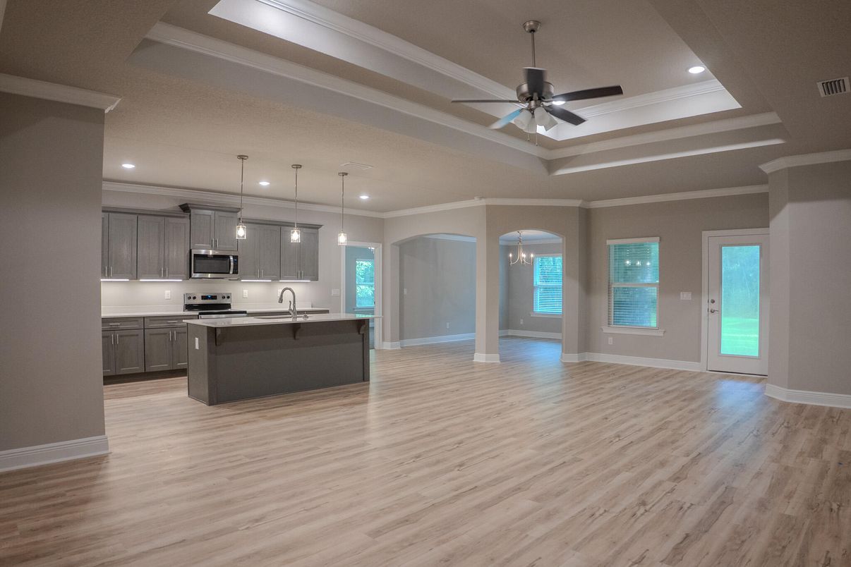 Empty room, Interior, Kitchen, Pendant Lights, Recessed Lighting, Stainless Steel Appliances, Wood Texture Flooring