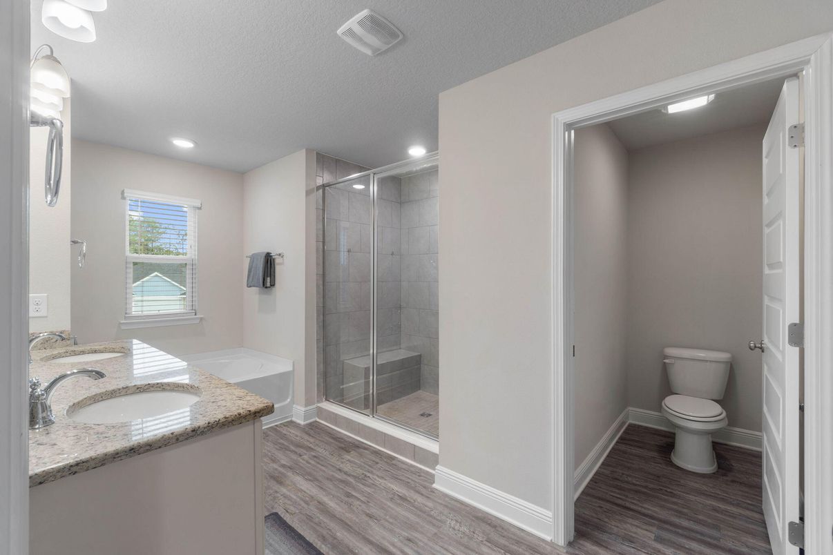 Bathroom, Dual Sink Vanities, Glass Shower, Interior, Recessed Lighting, Wood Texture Flooring