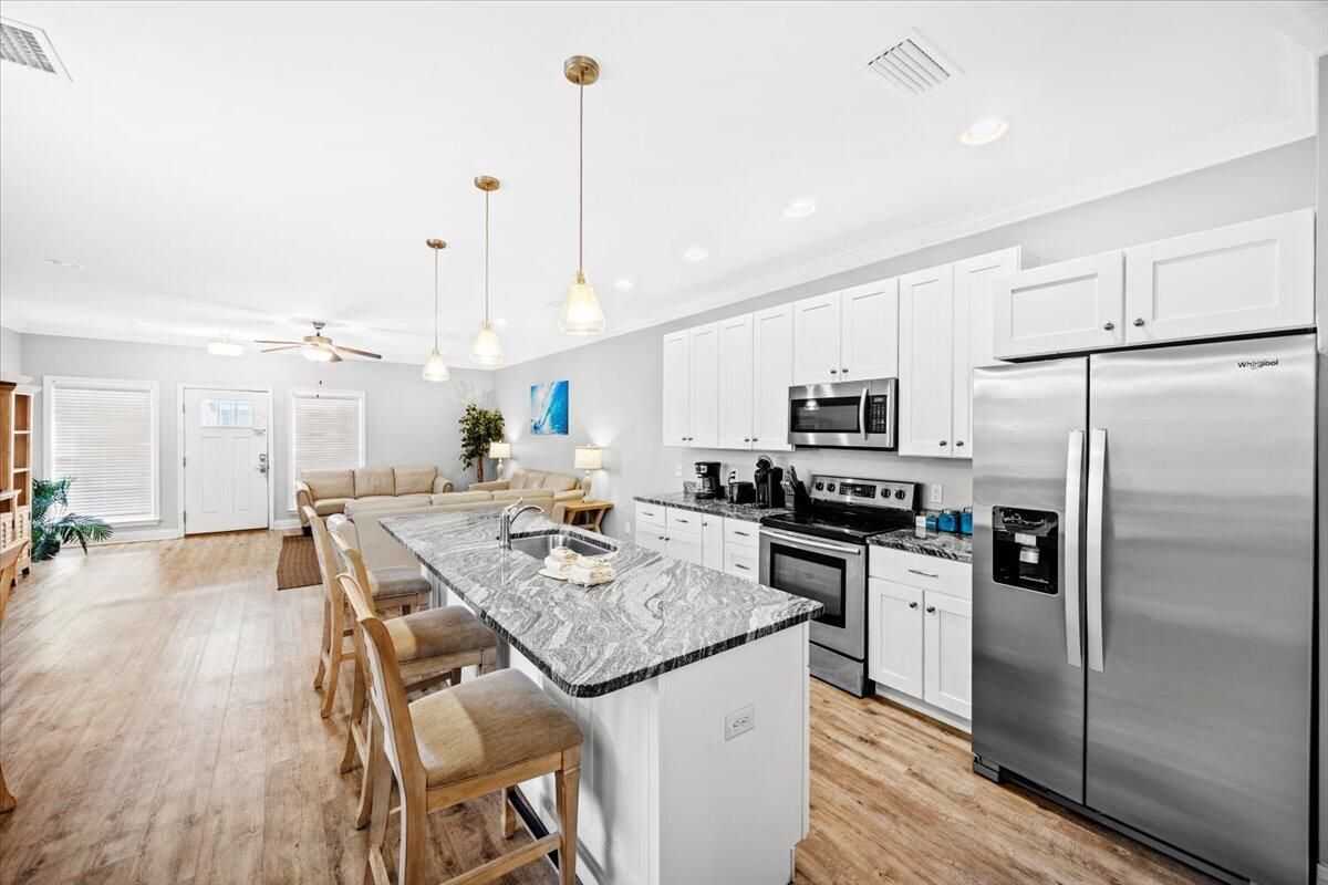 Dining room, Interior, Kitchen, Living room, Pendant Lights, Recessed Lighting, Stainless Steel Appliances, Wood Texture Flooring