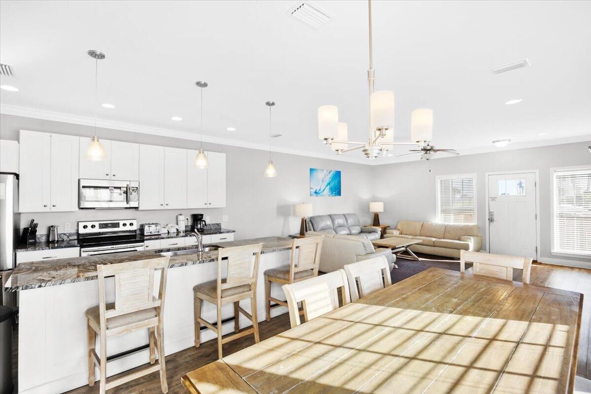 Dining room, Interior, Kitchen, Living room, Pendant Lights, Recessed Lighting, Stainless Steel Appliances, Wood Texture Flooring
