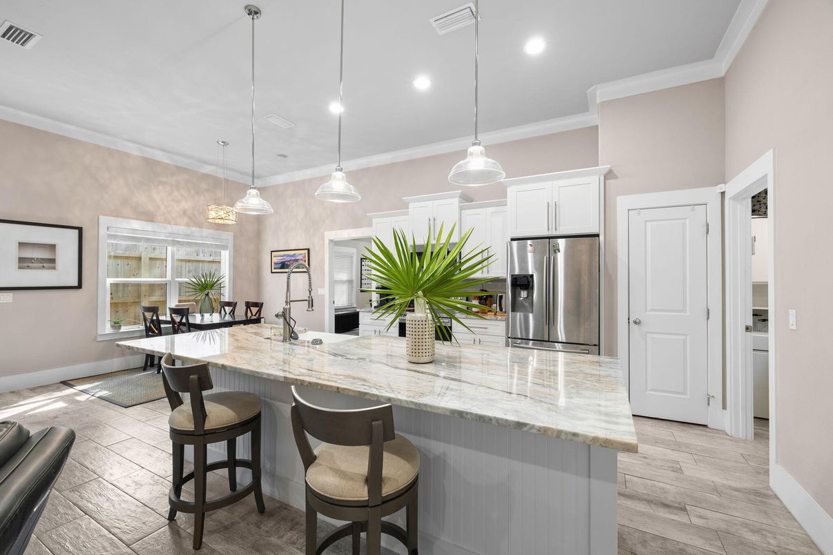 Dining room, Interior, Kitchen, Pendant Lights, Recessed Lighting, Stainless Steel Appliances, Wood Texture Flooring