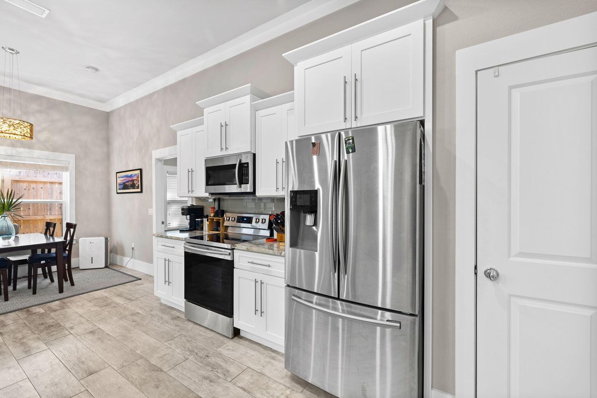 Dining room, Interior, Kitchen, Pendant Lights, Stainless Steel Appliances, Wood Texture Flooring