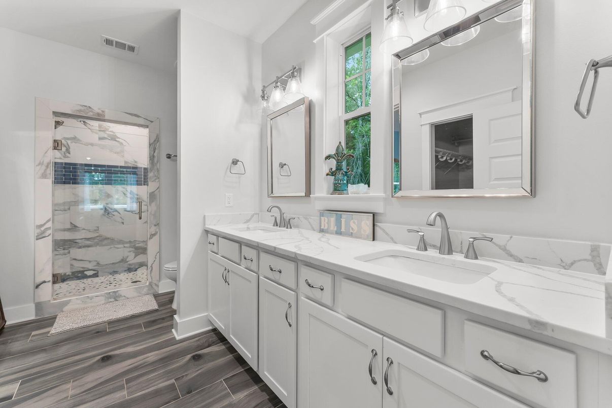 Bathroom, Dual Sink Vanities, Glass Shower, Interior, Marble Walls, Wood Texture Flooring