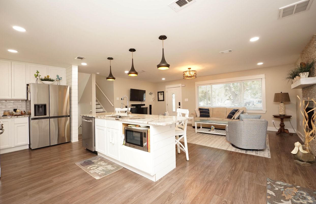 Fireplace, Interior, Kitchen, Living room, Pendant Lights, Recessed Lighting, Stainless Steel Appliances, Wood Texture Flooring