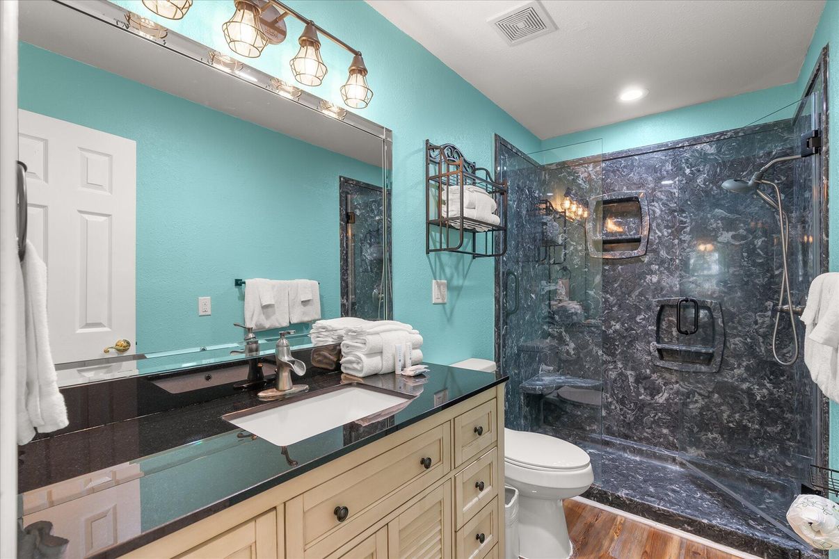 Bathroom, Glass Shower, Interior, Marble Walls, Recessed Lighting, Wood Texture Flooring