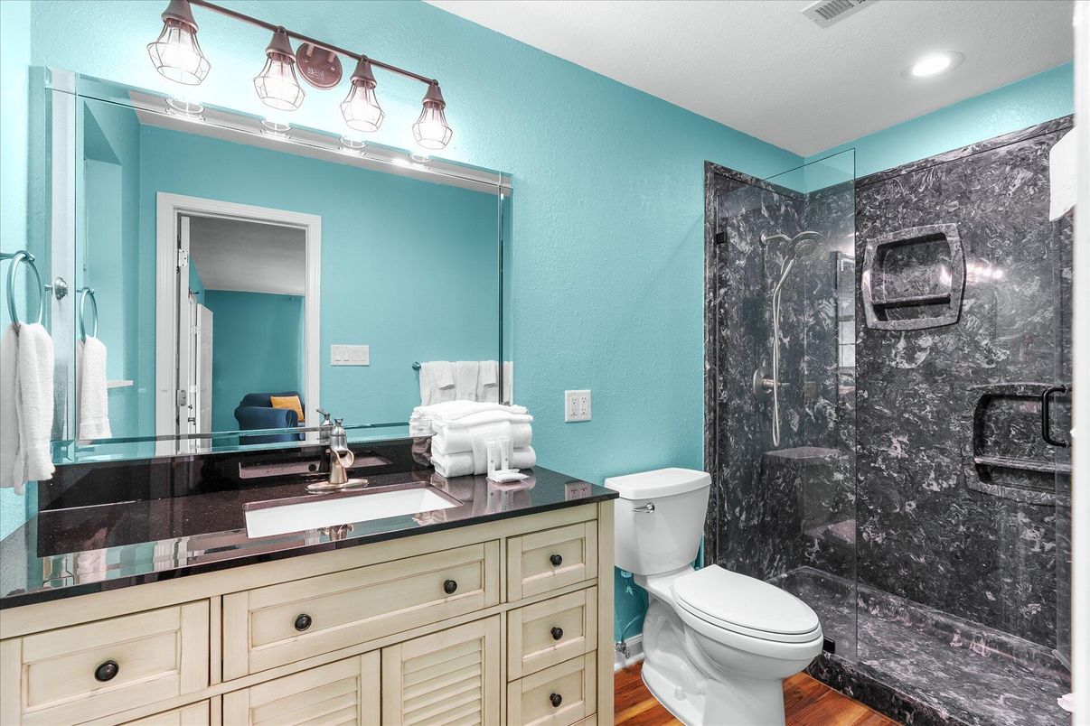 Bathroom, Glass Shower, Interior, Marble Walls, Recessed Lighting, Wood Texture Flooring