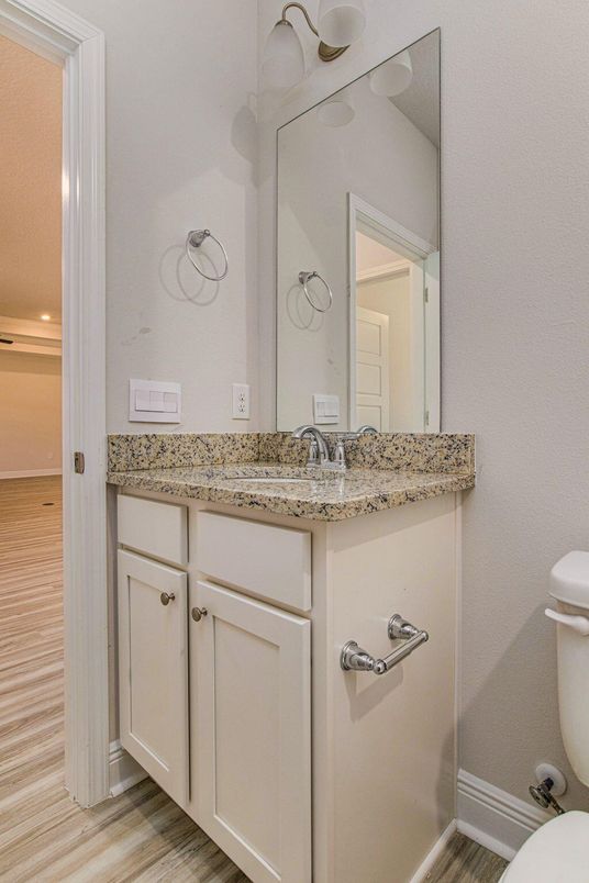 Bathroom, Dual Sink Vanities, Interior, Recessed Lighting, Wood Texture Flooring