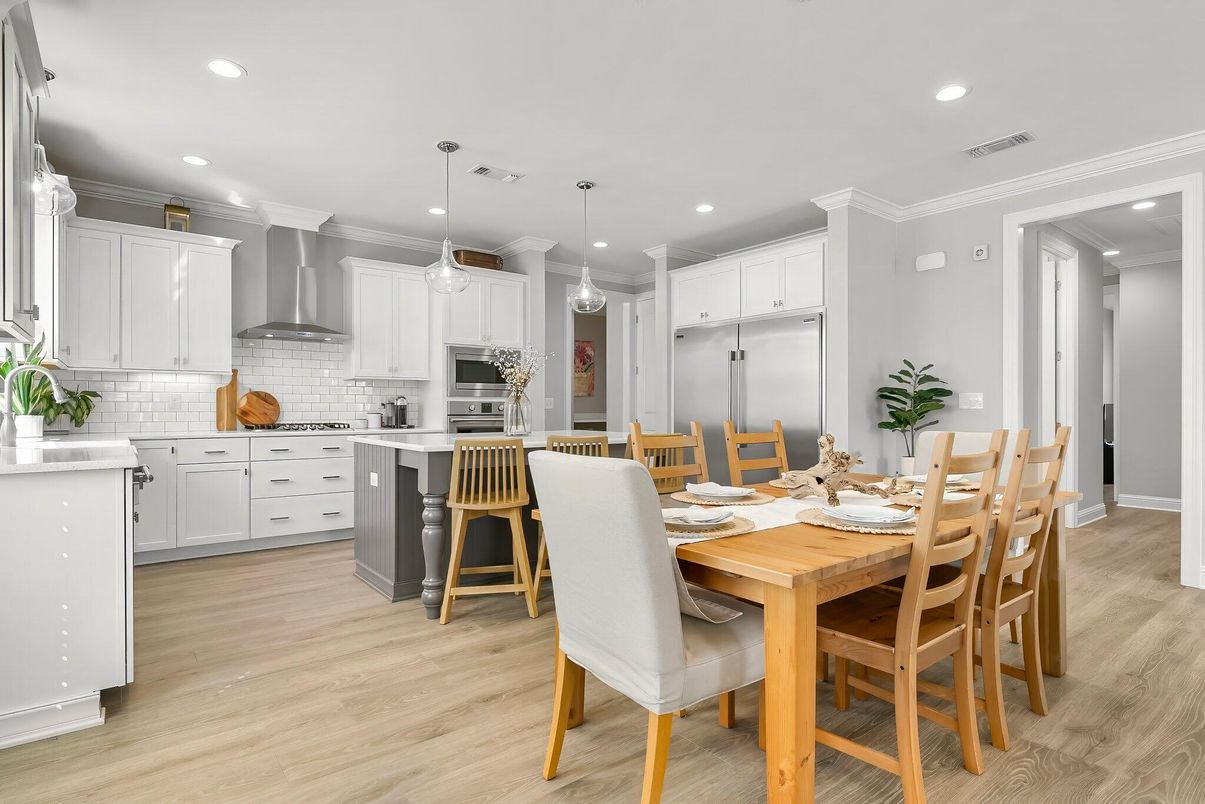 Dining room, Interior, Kitchen, Pendant Lights, Recessed Lighting, Stainless Steel Appliances, Wood Texture Flooring
