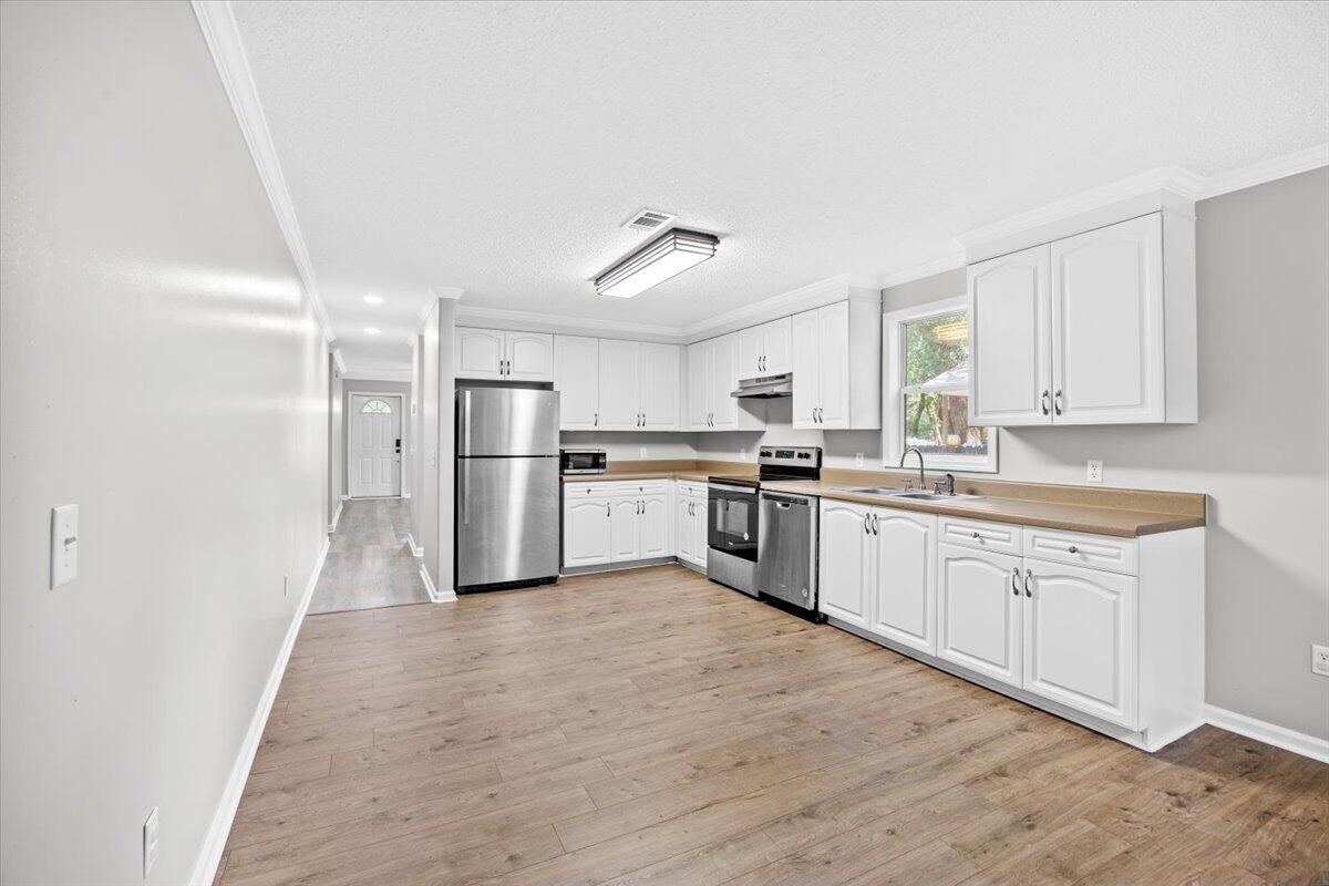 Interior, Kitchen, Recessed Lighting, Stainless Steel Appliances, Wood Texture Flooring
