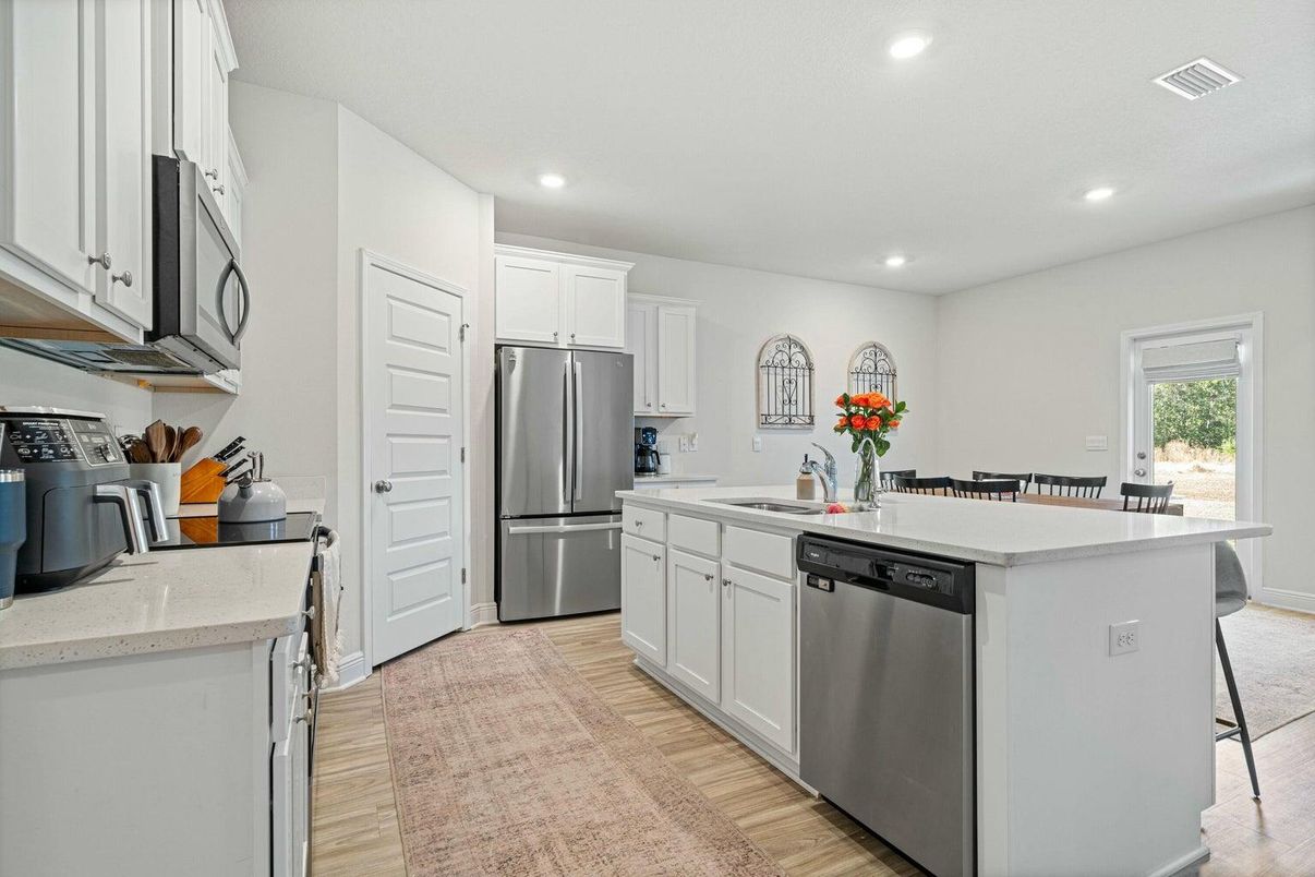 Dining room, Interior, Kitchen, Recessed Lighting, Stainless Steel Appliances, Wood Texture Flooring
