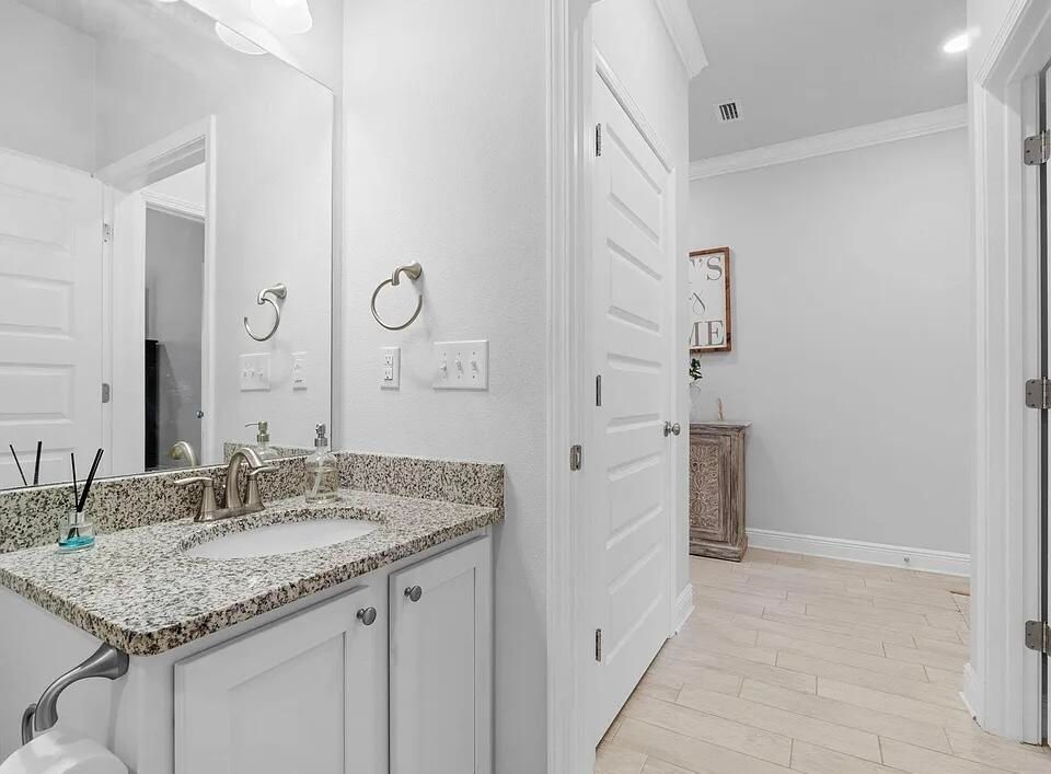 Bathroom, Dual Sink Vanities, Interior, Recessed Lighting, Wood Texture Flooring
