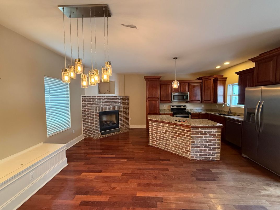 Fireplace, Interior, Kitchen, Pendant Lights, Recessed Lighting, Stainless Steel Appliances, Wood Texture Flooring