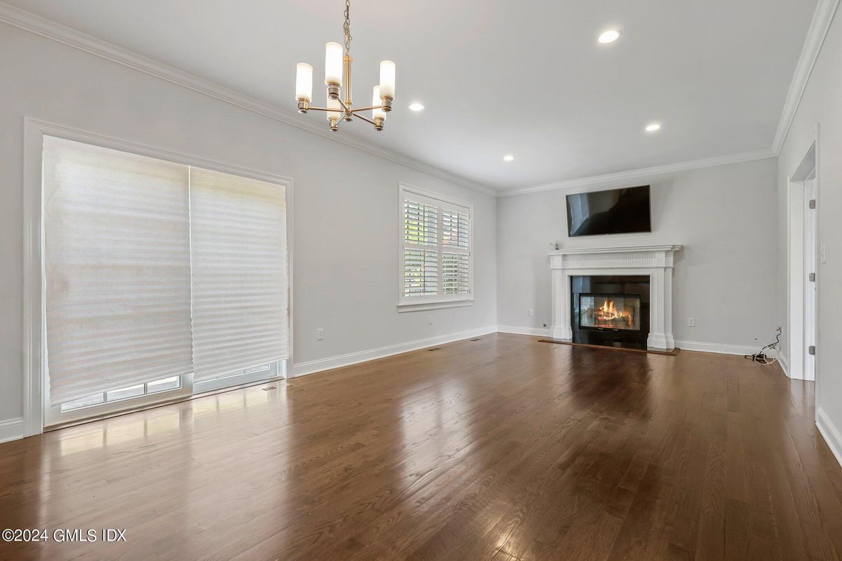 Chandelier, Empty room, Fireplace, Interior, Recessed Lighting, Wood Texture Flooring