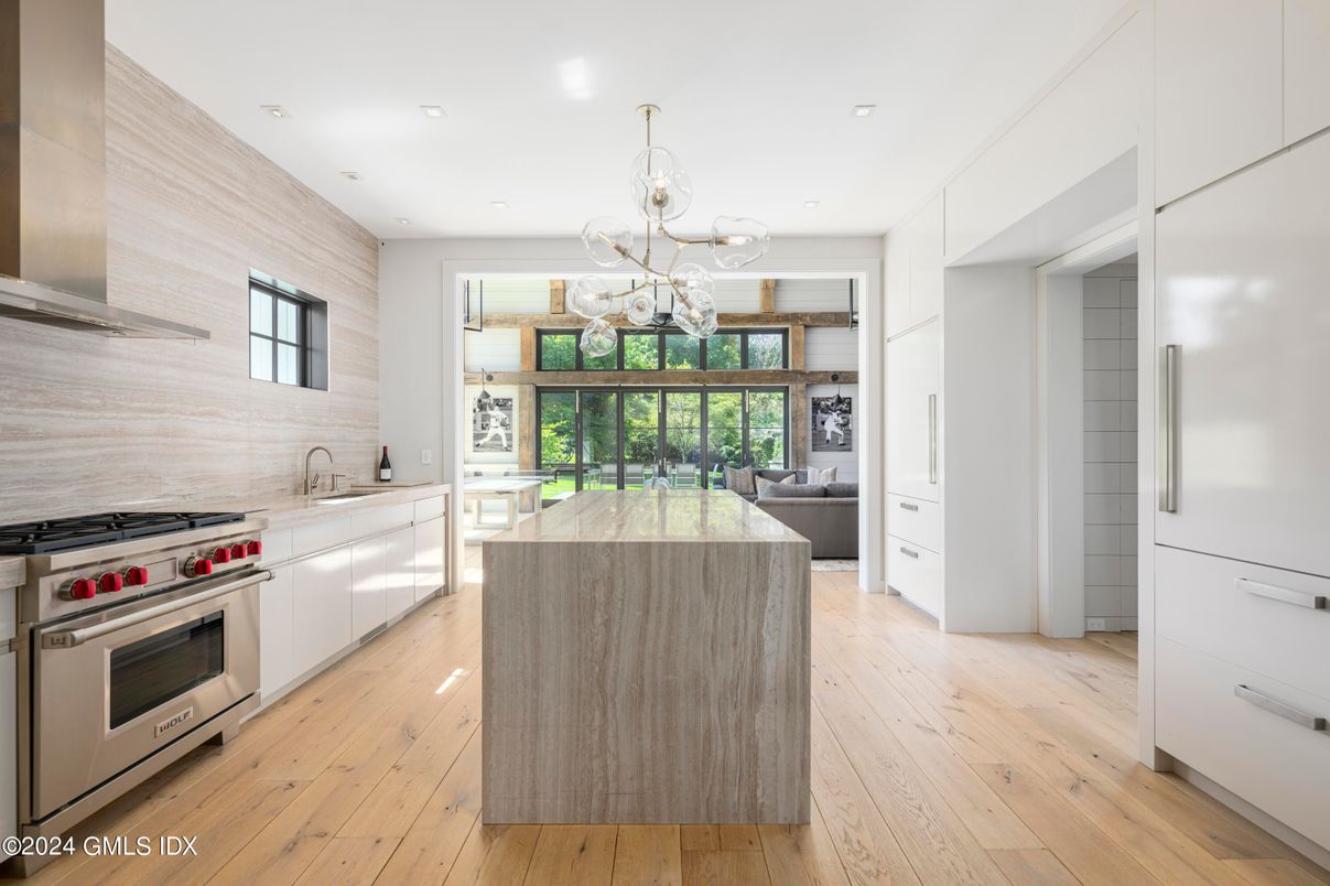 Chandelier, Interior, Kitchen, Living room, Pendant Lights, Recessed Lighting, Stainless Steel Appliances, Wood Texture Flooring