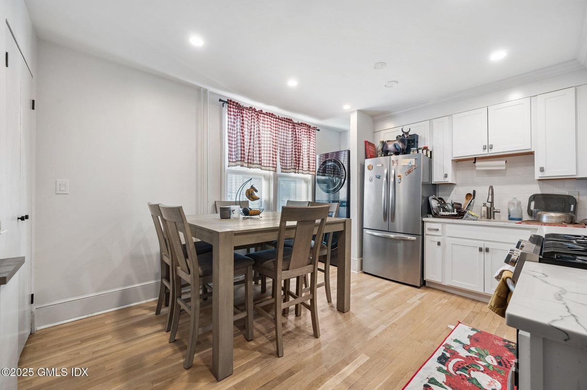 Dining room, Interior, Kitchen, Recessed Lighting, Stainless Steel Appliances, Wood Texture Flooring