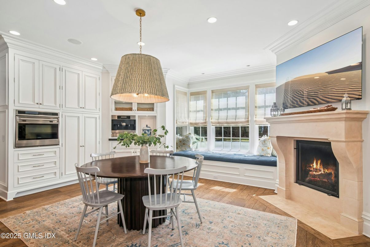 Dining room, Fireplace, Interior, Kitchen, Pendant Lights, Recessed Lighting, Stainless Steel Appliances, Wood Texture Flooring