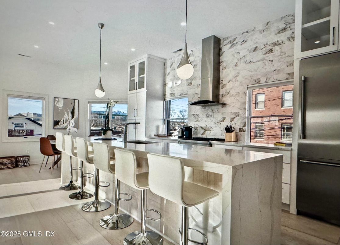Interior, Kitchen, Marble Walls, Pendant Lights, Recessed Lighting, Stainless Steel Appliances