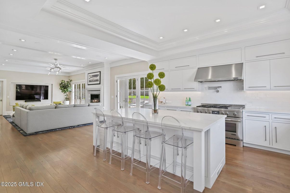 Fireplace, Interior, Kitchen, Living room, Recessed Lighting, Stainless Steel Appliances, Wood Texture Flooring