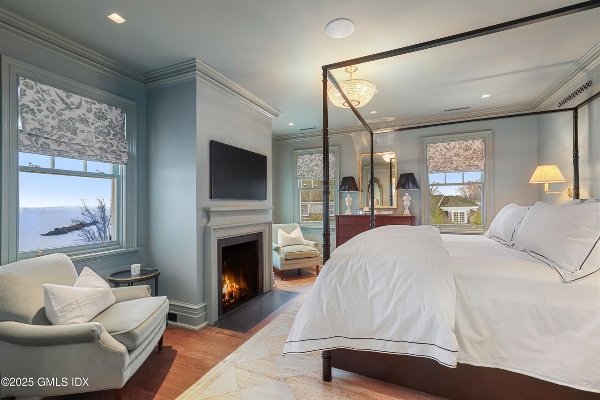 Bedroom, Fireplace, Interior, Recessed Lighting, Water, Wood Texture Flooring