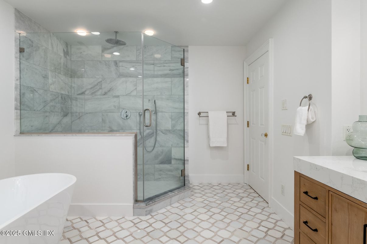 Bathroom, Free Standing Baths, Glass Shower, Interior, Marble Walls, Recessed Lighting