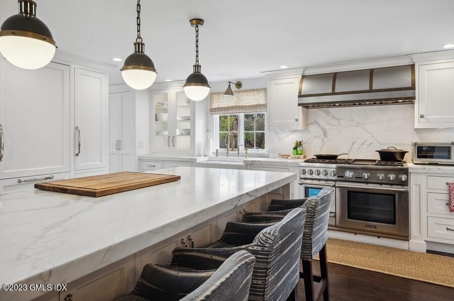 Interior, Kitchen, Marble Walls, Pendant Lights, Recessed Lighting, Stainless Steel Appliances, Wood Texture Flooring