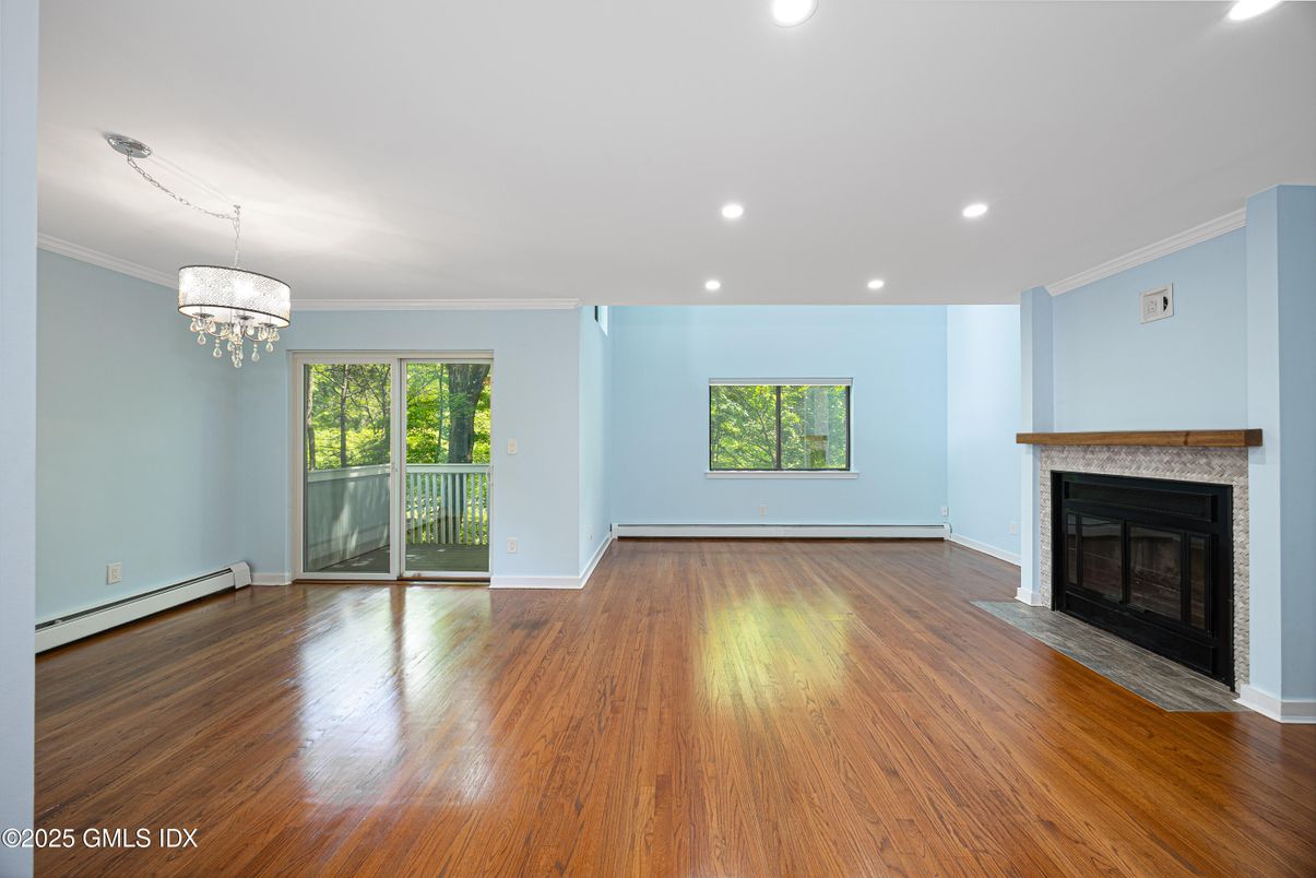 Chandelier, Empty room, Fireplace, Interior, Recessed Lighting, Wood Texture Flooring