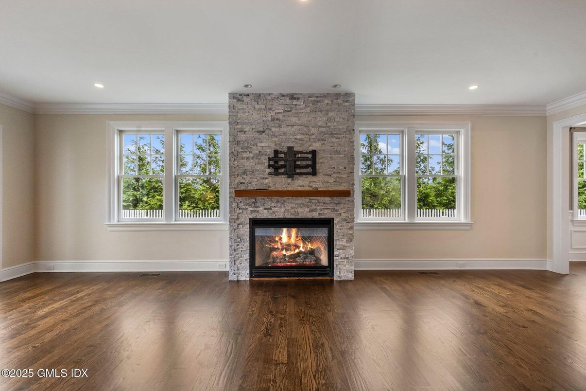 Empty room, Fireplace, Interior, Recessed Lighting, Stone Walls, Wood Texture Flooring