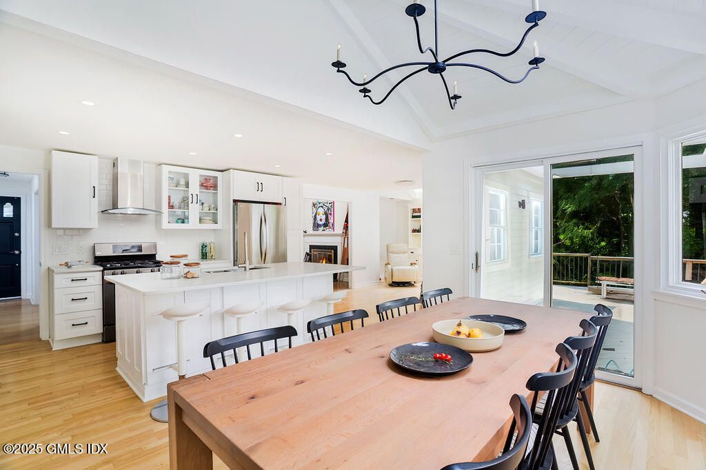 Dining room, Interior, Kitchen, Pendant Lights, Recessed Lighting, Stainless Steel Appliances, Wood Texture Flooring