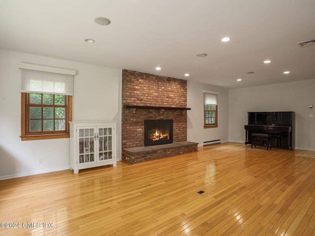 Fireplace, Interior, Piano, Recessed Lighting, Stone Walls, Wood Texture Flooring