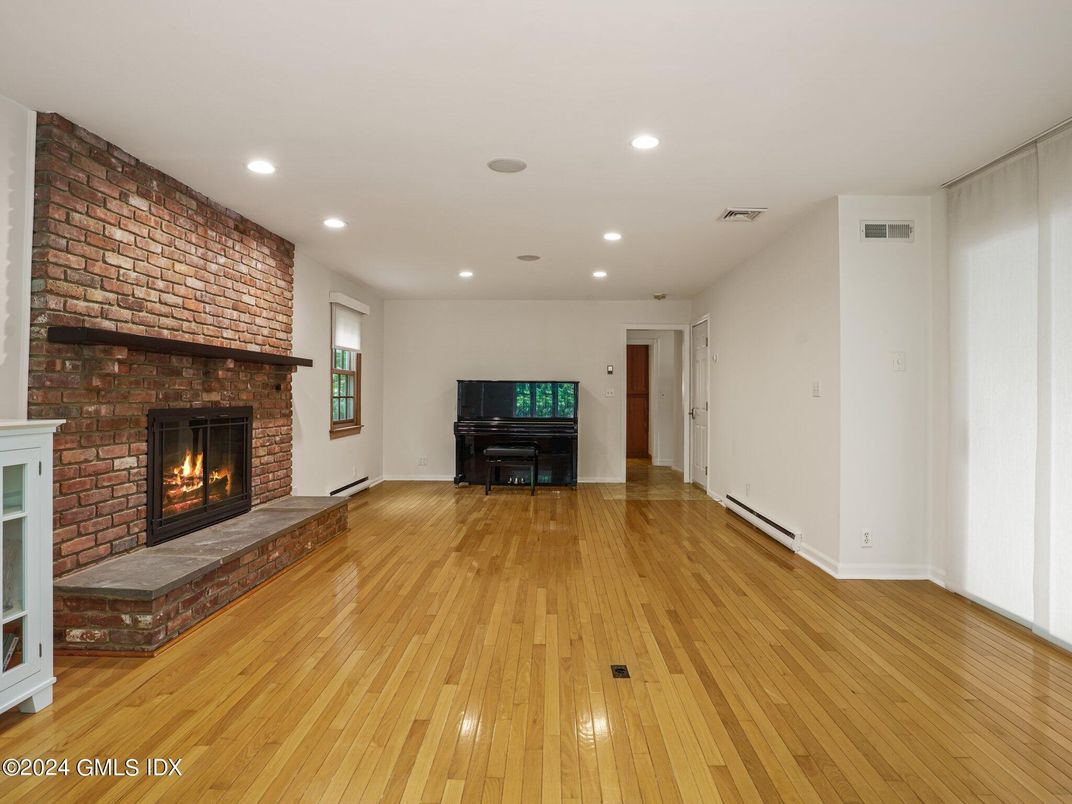 Fireplace, Interior, Piano, Recessed Lighting, Stone Walls, Wood Texture Flooring
