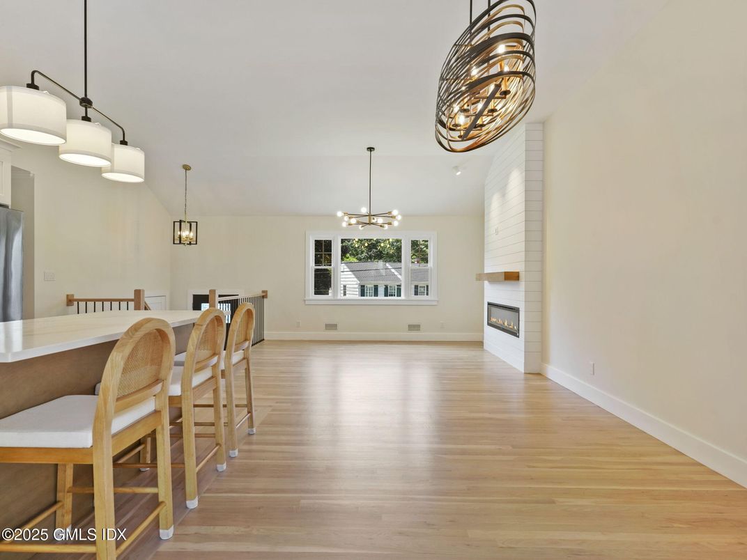 Chandelier, Dining room, Fireplace, Interior, Pendant Lights, Wood Texture Flooring