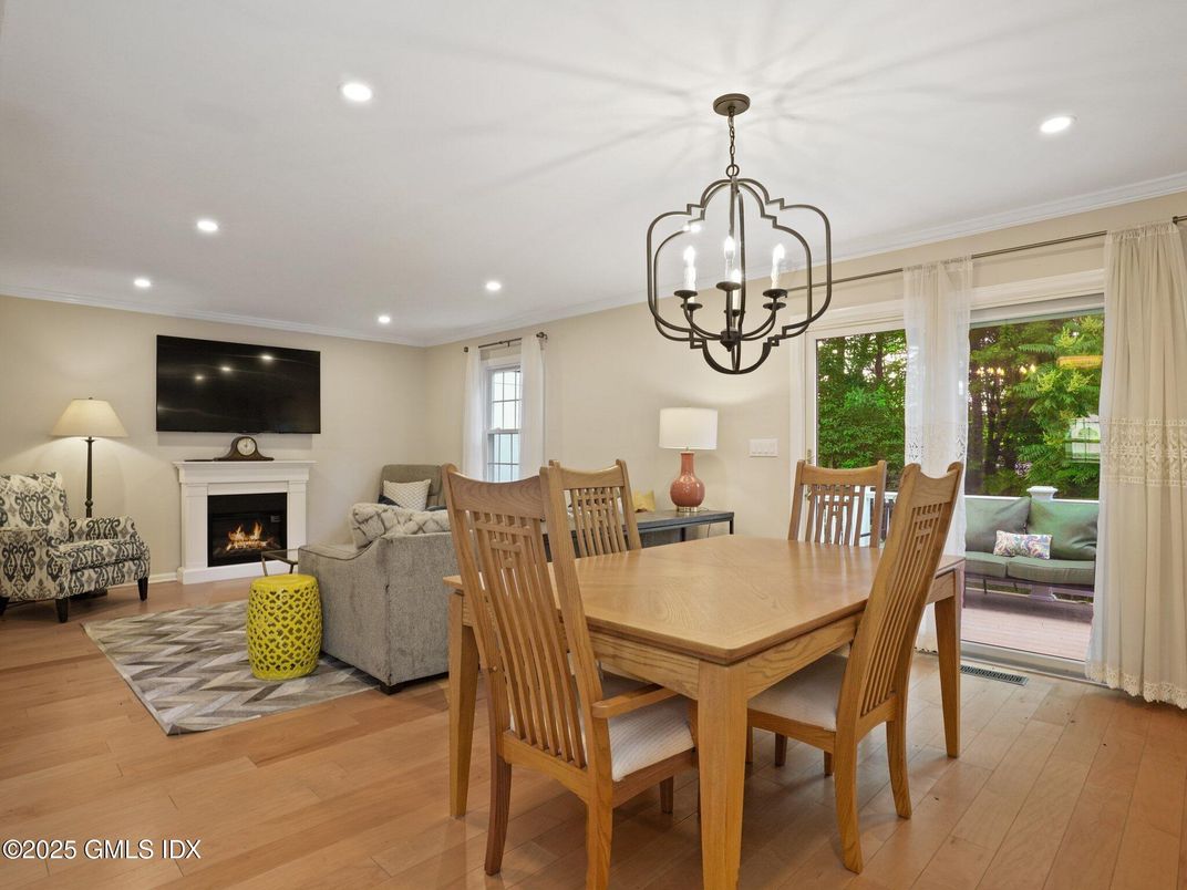 Chandelier, Dining room, Fireplace, Interior, Living room, Recessed Lighting, Wood Texture Flooring