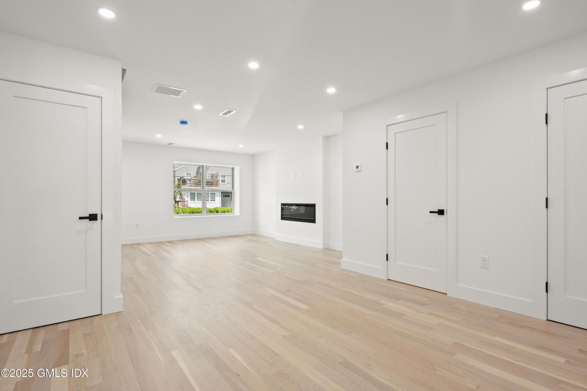 Empty room, Fireplace, Interior, Recessed Lighting, Wood Texture Flooring
