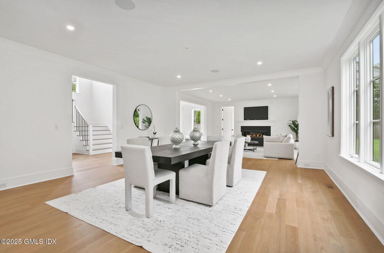 Dining room, Fireplace, Interior, Living room, Recessed Lighting, Wood Texture Flooring
