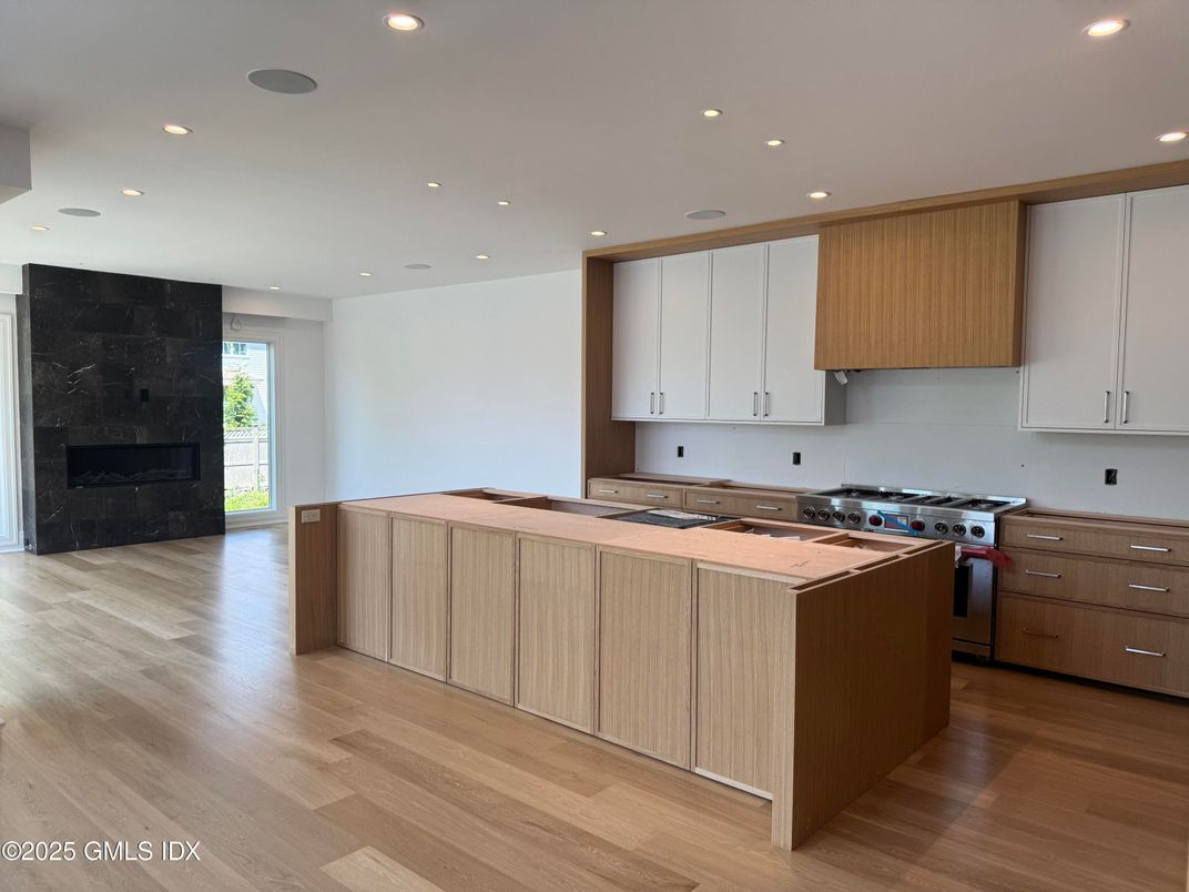 Fireplace, Interior, Kitchen, Recessed Lighting, Wood Texture Flooring