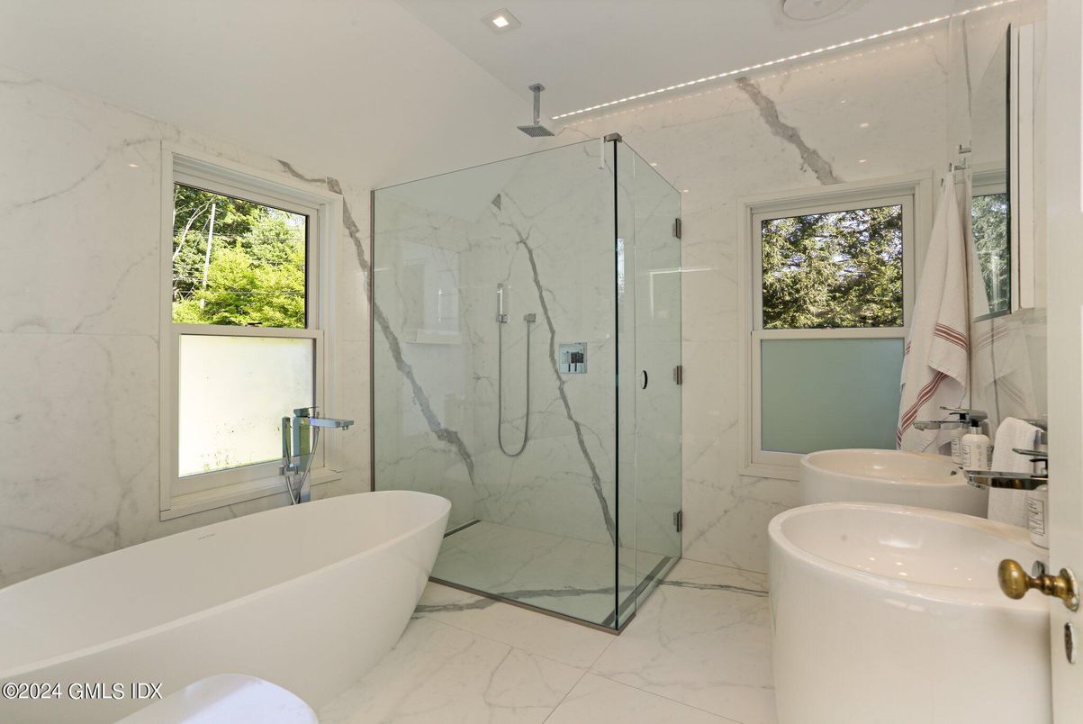 Bathroom, Free Standing Baths, Glass Shower, Interior, Marble, Marble Walls, Recessed Lighting