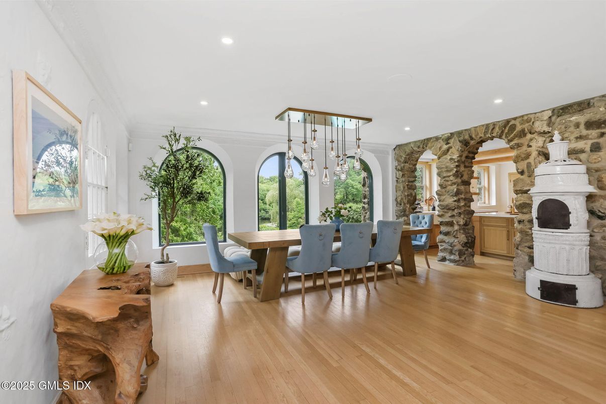 Dining room, Fireplace, Interior, Pendant Lights, Recessed Lighting, Stone Walls, Wood Texture Flooring