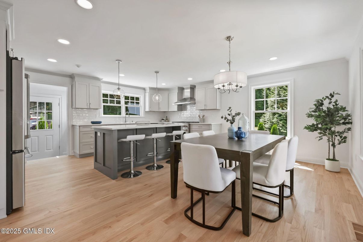 Chandelier, Dining room, Interior, Kitchen, Pendant Lights, Recessed Lighting, Stainless Steel Appliances, Wood Texture Flooring