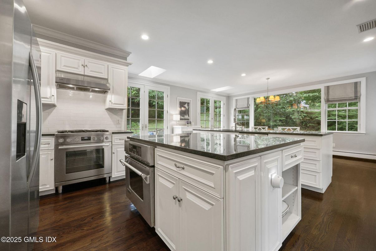 Chandelier, Interior, Kitchen, Pendant Lights, Recessed Lighting, Stainless Steel Appliances, Wood Texture Flooring