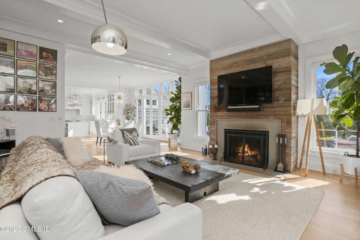 Chandelier, Dining room, Fireplace, Interior, Living room, Pendant Lights, Recessed Lighting, Wood Texture Flooring